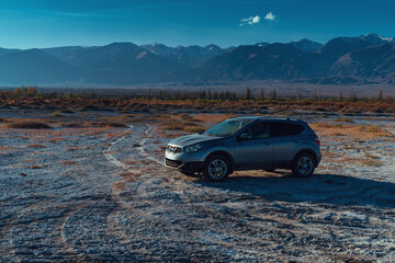 Poster - Car on the surface of a dried-up salt lake