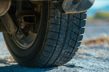 Canvas Print - Car wheel on the surface of a dried-up salt lake