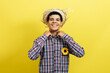 canvas print picture - Brazilian teenager boy wearing typical clothes for the Festa Junina on color background