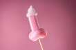 © Beauty Of Things - Pink sugary lollipop in form of penis on stick on a pink plain background