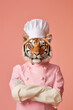 An anthropomorphic tiger dressed as a chef with a hyper-realistic hat,  shown proudly in his uniform, sophistication haute cuisine with the tenderness of a feline on a peach background,Generative AI