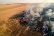aerial view dramatic spring forest fire, flames in dry grass in agricultural fields. ecological risk
