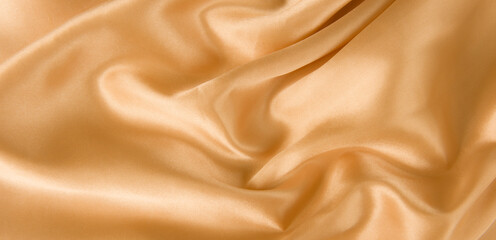 Wall Mural - brown or gold silk fabric texture for background