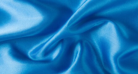 Wall Mural - Abstract blue silk fabric texture background. Creases of satin	
