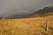 © robertharding - A rainbow arcs across countryside near the town of Stykkisholmur, Snaefellsnes peninsula, west coast of Iceland, Polar Regions
