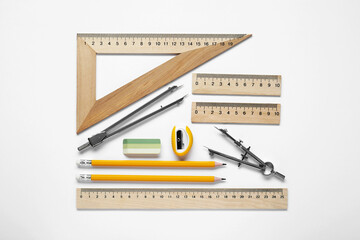 Wall Mural - Different rulers and stationery on white background, top view