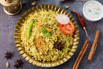 Wall Mural - Chicken biryani Spicy Indian Malabar biryani Hyderabadi biryani Dum Biriyani pulao golden bowl Kerala India Sri Lanka Pakistan basmati rice mixed rice dish with meat curry Ramadan Kareem Eid