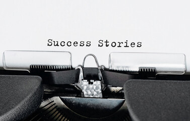 Wall Mural - Text success stories typed on retro typewriter