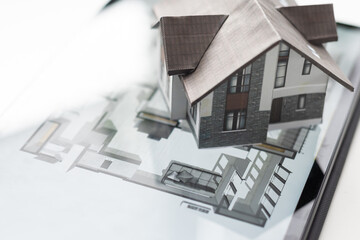 Poster - Small house model is on screen tablet and icons home electronics devices connecting with wireless. Smart home controlled and Automation system technology of things.