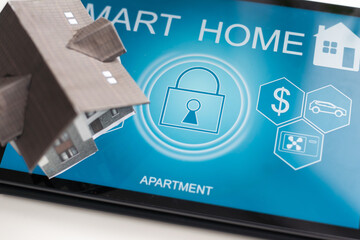 Poster - Small house model is on screen tablet and icons home electronics devices connecting with wireless. Smart home controlled and Automation system technology of things.