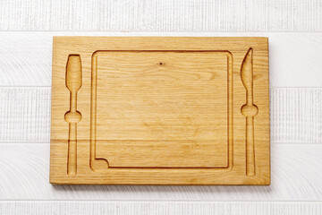 Wall Mural - Wooden cutting board on kitchen table