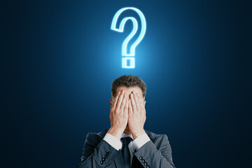 Poster - Facepalm man with question sign over his head, doubt and decision concept on dark blue background
