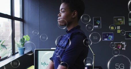 Poster - Animation of multiple 5g text banner over african american woman looking out of window at office