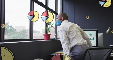 Poster - Animation of multiple pie graph icons over biracial man in face mask looking out of window at office