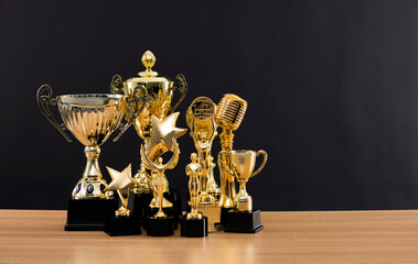 Wall Mural - Group of trophies on wooden table