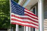 Fototapeta  - American flag hanging proudly on a front porch, American Flag, Independence Day Generative AI