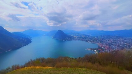 Wall Mural - Alpine landscape with hazy Lake Lugano from Monte Bre, Switzerland