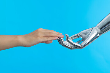 Human hand touching robot hand