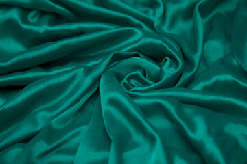 Teal, fabric background.
