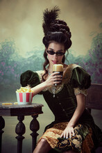 Portrait Of Beautfiufl Young Girl, Princess In Elegant Drss And Sunglasss Drinking Foamy Beer, Eating Fries Against Dark Vintage Background. Concept Of History, Renaissance Art, Comparison Of Eras