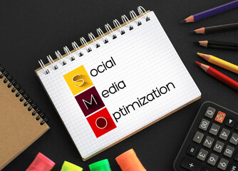 Poster - SMO - Social Media Optimization acronym on notepad, internet concept background