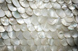 Background of many mother-of-pearl parts of oyster shells. Generative AI.