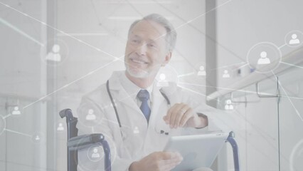 Poster - Animation of network of connections with icons over caucasian male doctor using tablet in wheelchair