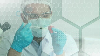 Poster - Animation of hexagons over caucasian male scientist vaccinating strawberry