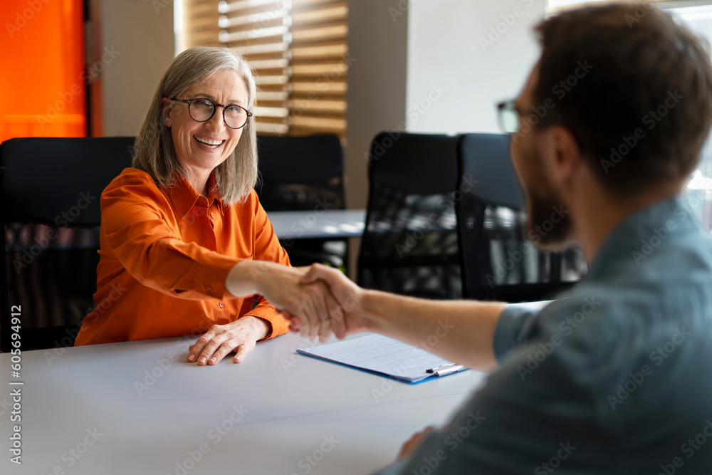 Group of smiling business people hand shaking working together in ...
