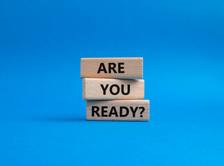 Wall Mural - Are you ready symbol. Concept word Are you ready on wooden blocks. Beautiful blue background. Business and Are you ready concept. Copy space