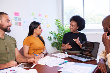 diverse development team discusses code during code review meeting, programming