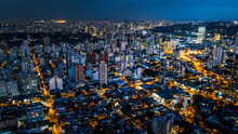 View From Above The City Of São Paulo At Night, City Lights, Buildings And Houses Lit, Brazil