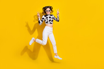 Sticker - Full length photo of cheerful cool girl wear cow skin shirt dark glasses v-signs empty space isolated yellow color background