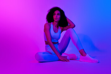 Sticker - Full body photo of attractive sportswoman model posing sitting look visual effect empty space advert gym isolated over blue pink background