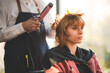 © chokniti - Asian Hairdresser giving treatment and barber occupation service, Professional hairstylist combing and using scissors cut woman's hair to young beautiful customer girl in beauty salon