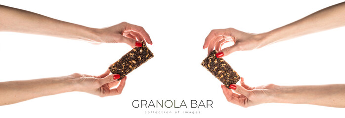 Wall Mural - Healthy granola bar (muesli or cereal bar) isolated on white background. Muesli bar in females hands with red manicure.