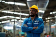 © KANGWANS - African American industrial experts stand in metal manufacturing factories with a smile.