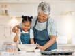 © K.A./peopleimages.com - Bake, grandmother and girl with ingredients, learning and development with utensils, food or love. Family, granny or female grandchild in a kitchen, dough or teaching skills with happiness or bonding