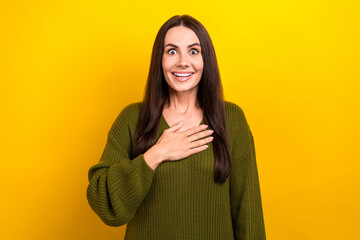 Poster - Portrait of cheerful impressed person hand touch chest beaming smile isolated on yellow color background