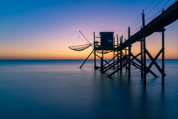  Fishing hut on stilts coast of Atlantic ocean at sunset near La Rochelle, Charente Maritime, France