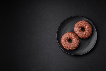 Delicious chocolate glazed donut sprinkled with chocolate chips