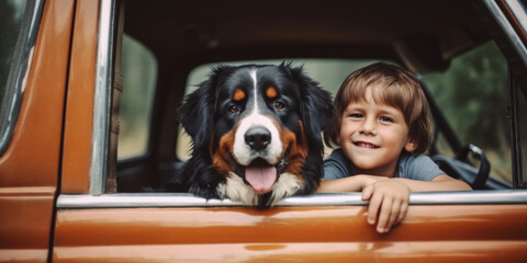 Portrait of cute bernese shepherd and little boy on the car window vacation travel