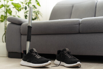 High angle background of disassembled prosthetic leg and foot on table in orthopedic equipment shop, disability concept