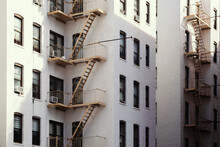 New York City Tenement Buildings With Orange Fire Escapes Background