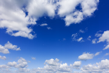 Wall Mural - Photo of a clear blue sky and white clouds over horizon..