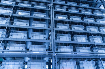 plastic boxes in the cells of the automated warehouse. Metal construction warehouse shelving