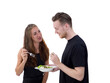 couple eating salad in the kitchen