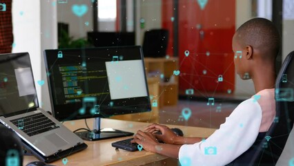 Poster - Animation of connected icons over african american woman working on computer at office
