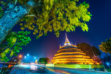 Beautiful The Lights On The Road With Yellow Flowers Cassia Fistula At Park In Phra Chedi Luang In Temple (Wat Ratchaburana) Is A Buddhist Temple In Phitsanulok,Thailand At Natural Twilight