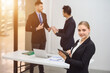 © เลิศลักษณ์ ทิพชัย - Portrait of a young secretary or business woman Use a tablet to take meeting notes. female secretary working Confident smiling standing in office at team meeting